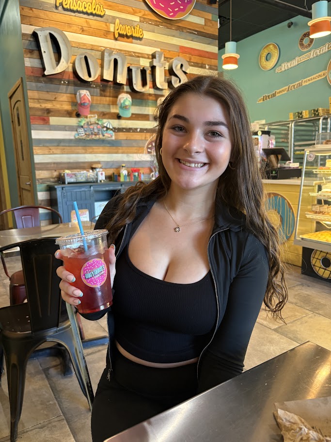 Customer Enjoying a Fruit Drink at Maynard's Donuts & Coffee
